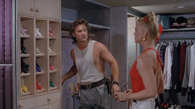 Kurt Russell and Goldie Hawn standing in large closet