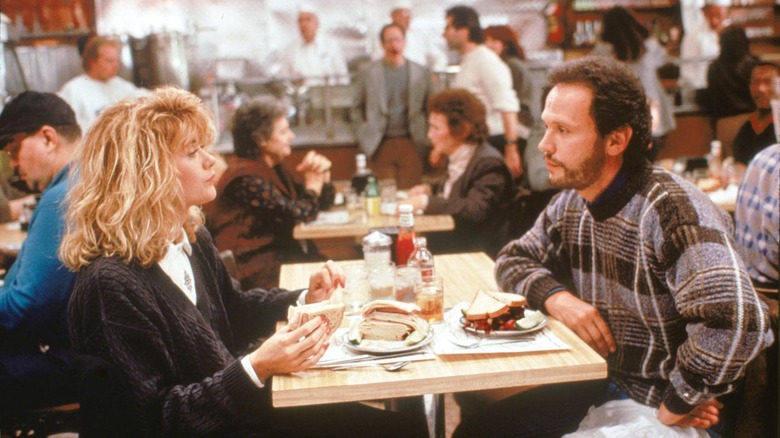 Harry and Sally sit at restaurant table