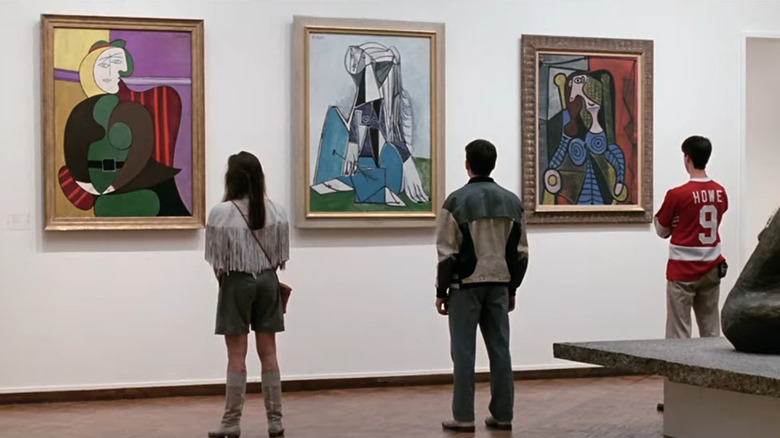 Sloane (Mia Sara), Ferris (Matthew Broderick), and Cameron (Alan Ruck) looking at paintings in Ferris Bueller's Day Off