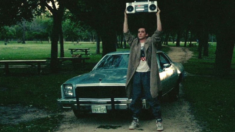 Lloyd (John Cusack) lifting up boom box in Say Anything
