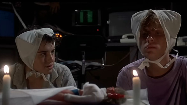 Wyatt (Ilan Mitchell-Smith) and Gary (Anthony Michael Hall) with bras on their heads in Weird Science