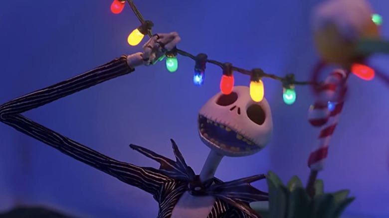 jack skellington hangs christmas lights