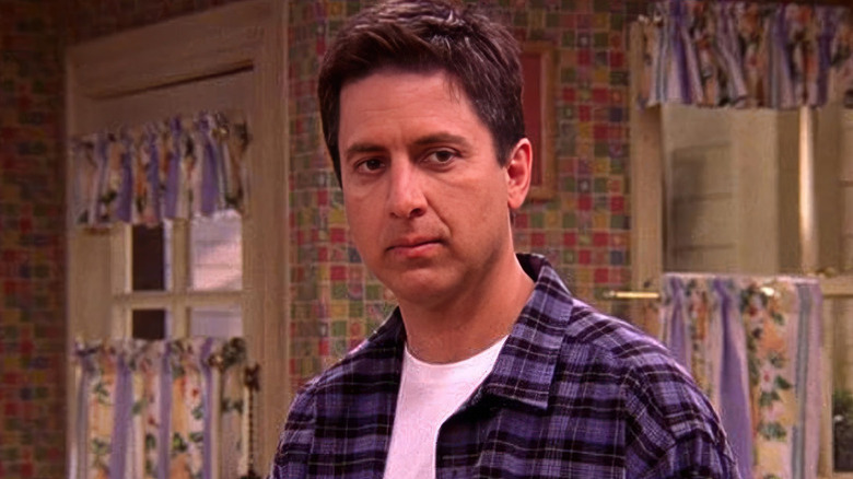 Ray Barone (Ray Romano) stands sullenly in the kitchen in Everybody Loves Raymond