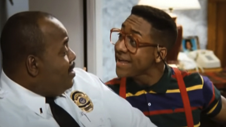 Steve Urkel (Jaleel White) tries to cheer up Carl Winslow (Reginald VelJohnson) in Family Matters