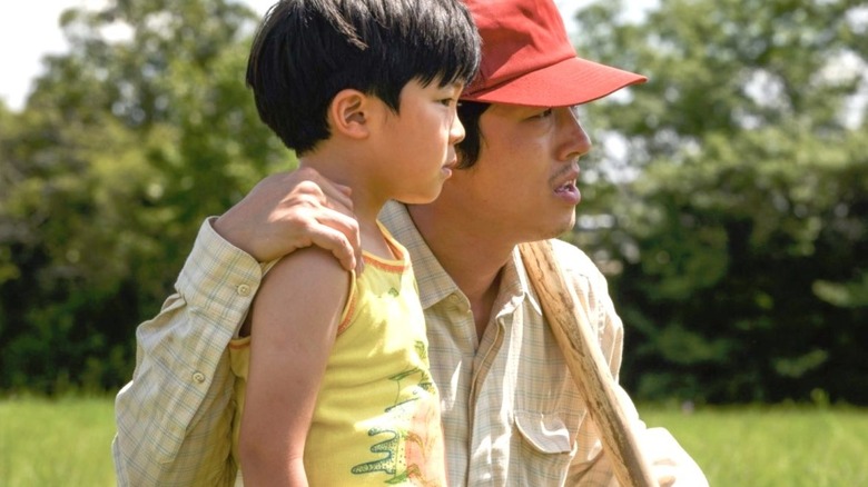 Jacob Yi (Steven Yeun) and David Yi (Alan Kim) examine a field in Minari