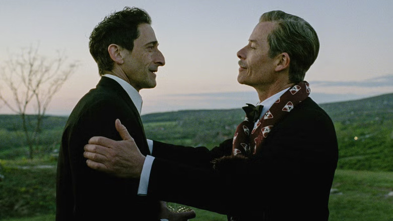 László Tóth (Adrien Brody) and Harrison Lee Van Buren (Guy Pearce) discuss business in The Brutalist