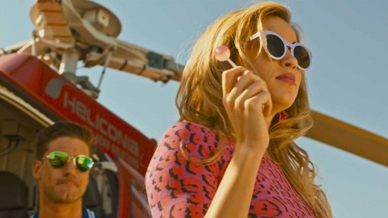 jen eats lollipop by helicopter in Revenge