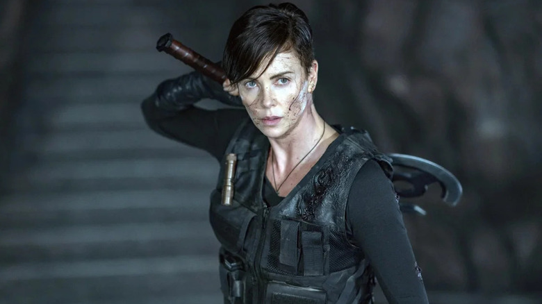 Charlize Theron as Andromache "Andy" of Scythia, preparing to wield her axe in The Old Guard
