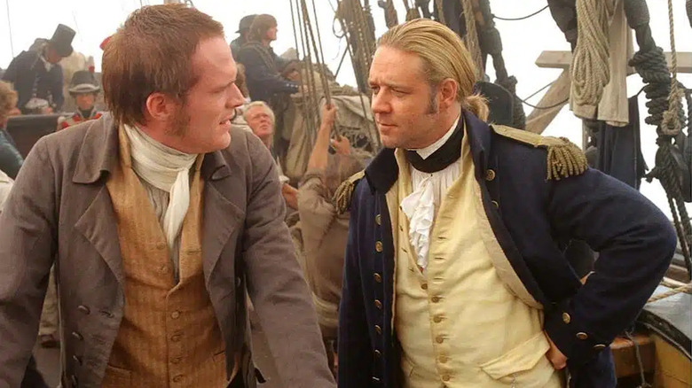 Stephen Maturin (Paul Bettany) speaks with Jack Aubrey (Russell Crowe) on board their frigate in Master and Commander: The Far Side of the World