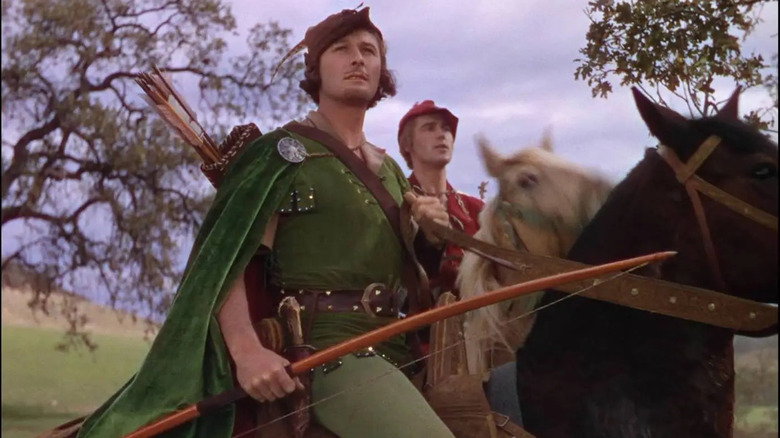 Robin Hood (Errol Flynn) and Will Scarlet (Patric Knowles) ride on horses together in The Adventures of Robin Hood