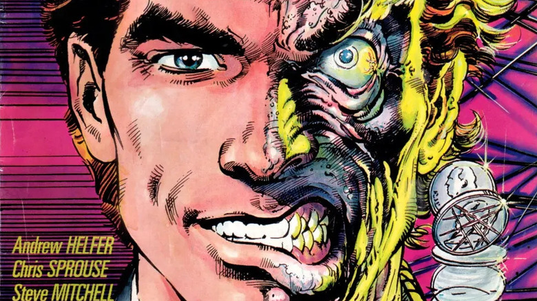 Harvey Dent/Two-Face flips a coin