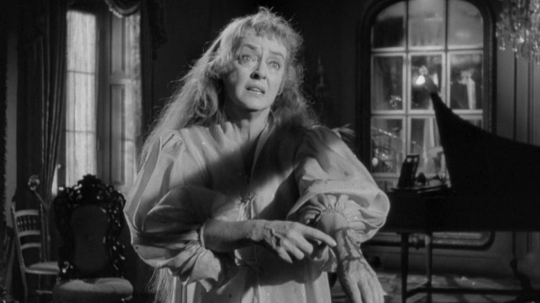 Bette Davis standing terrified