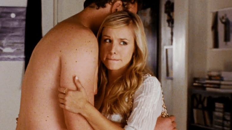Kristen Bell as Sarah Marshall hugging a naked Jason Segel as Peter in Forgetting Sarah Marshall