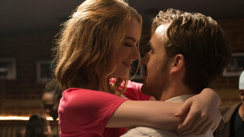 Emma Stone and Ryan Gosling as Mia and Sebastian embracing in La La Land