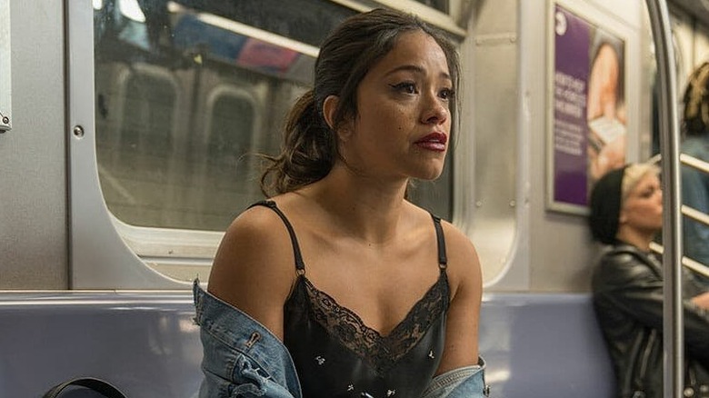 Gina Rodriguez as Jenny crying on the subway in Someone Great
