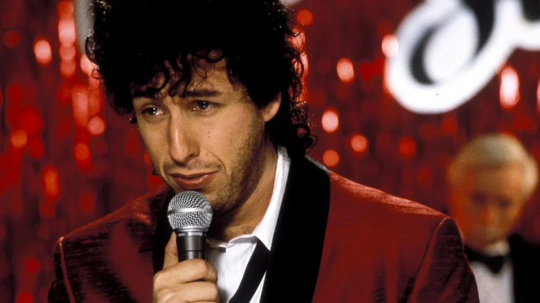 Adam Sandler as Robbie Hart crying on stage in The Wedding Singer