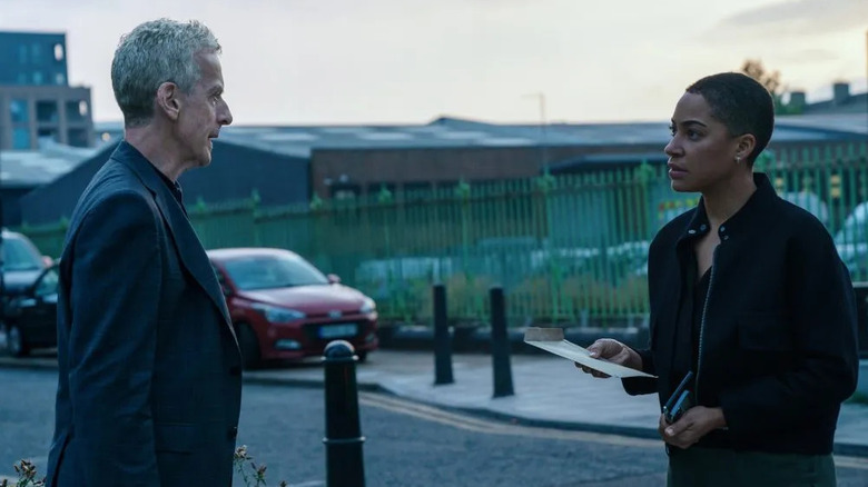 Daniel Hegarty (Peter Capaldi) and June Lenker (Cush Jumbo) speak to each other on the street in Criminal Record