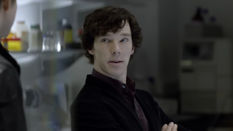 Sherlock Holmes (Benedict Cumberbatch) talking to someone in Sherlock