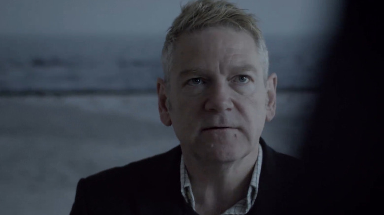 Kurt Wallander (Kenneth Branagh) glances up while walking outside in Wallander (2008)