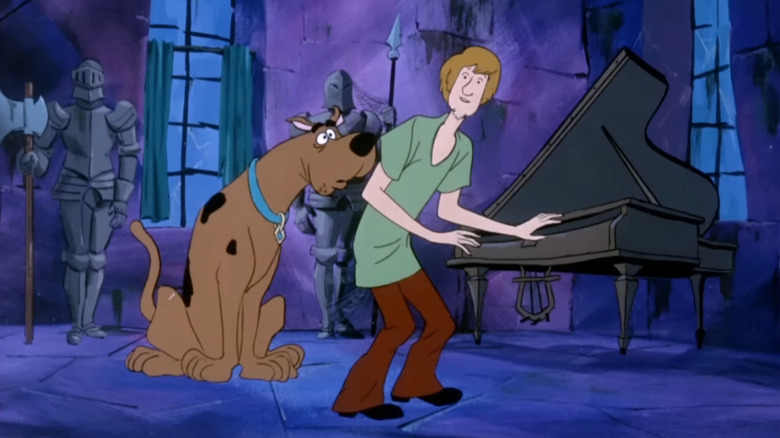Shaggy and Scooby-Doo sneaking around in a creepy house in Scooby-Doo, Where Are You!