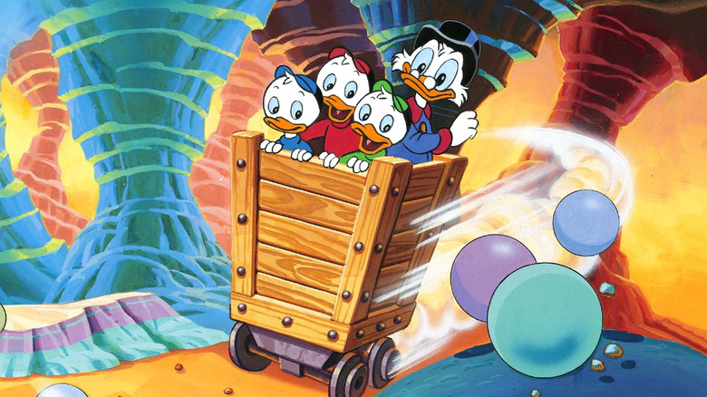 Scrooge McDuck in a minecart in a cave with Huey, Dewey, and Louie in DuckTales
