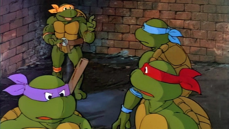 Michaelangelo speaking to Leonardo, Donatello, and Raphael in Teenage Mutant Ninja Turtles