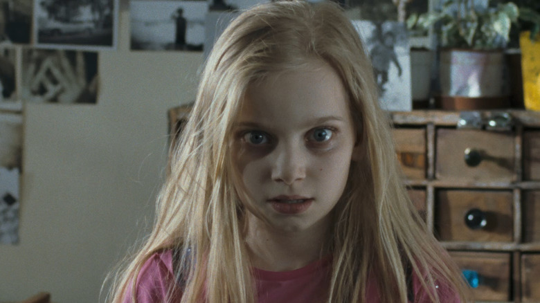 Young girl stares intensely