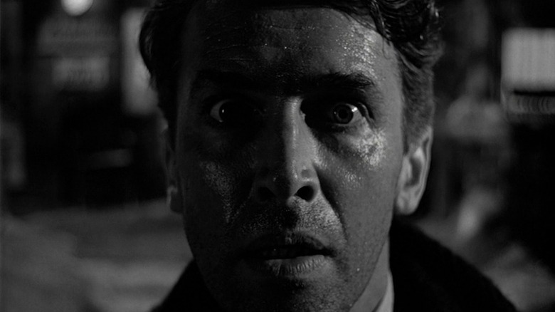 George Bailey (James Stewart) looks worried in It's A Wonderful Life