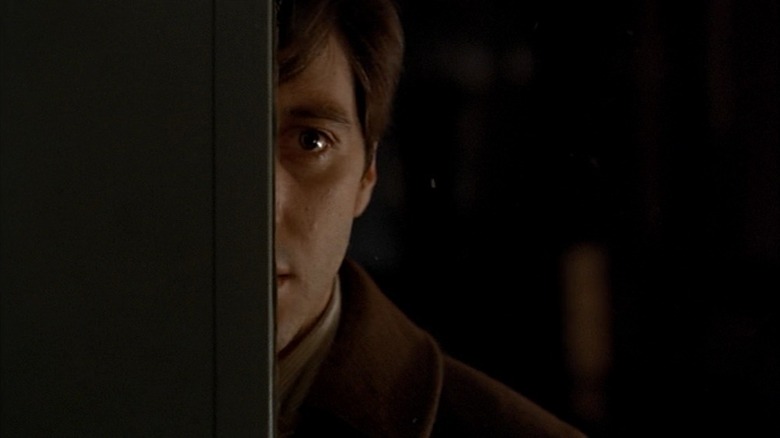 Michael Corleone (Al Pacino) hides behind a door in The Godfather