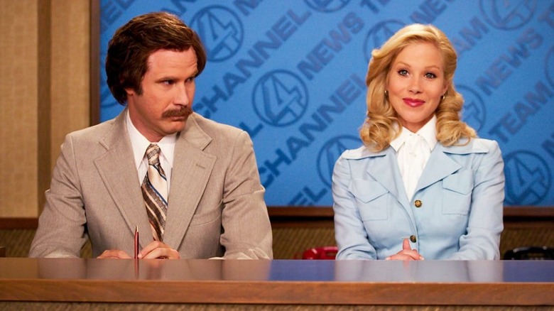 Will Ferrell as Ron Burgundy stares at Christina Applegate as Veronica Corningstone in Anchorman: The Legend of Ron Burgundy