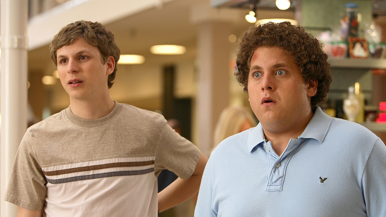 Michael Cera as Evan stands next to Jonah Hill as Seth in Superbad