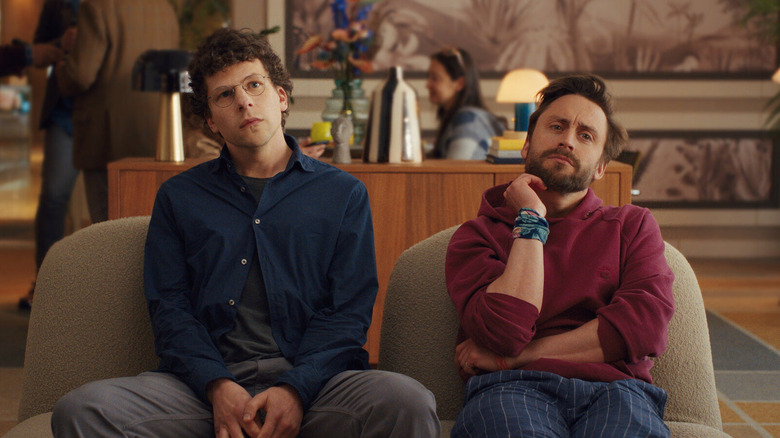 David (Jesse Eisenberg) and Benji (Kieran Culkin) meet tourmates in A Real Pain
