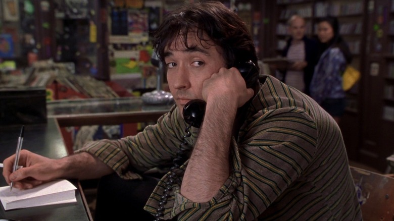 Rob (John Cusack) is melancholy on the phone in High Fidelity