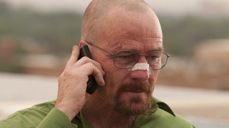 Walter White (Bryan Cranston) talks on the phone with a bandaged nose in Breaking Bad