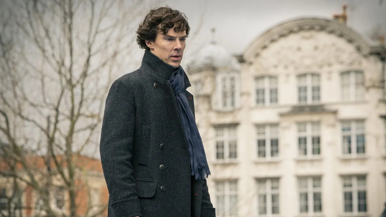 Sherlock Holmes (Benedict Cumberbatch) looks grimly downward in Sherlock