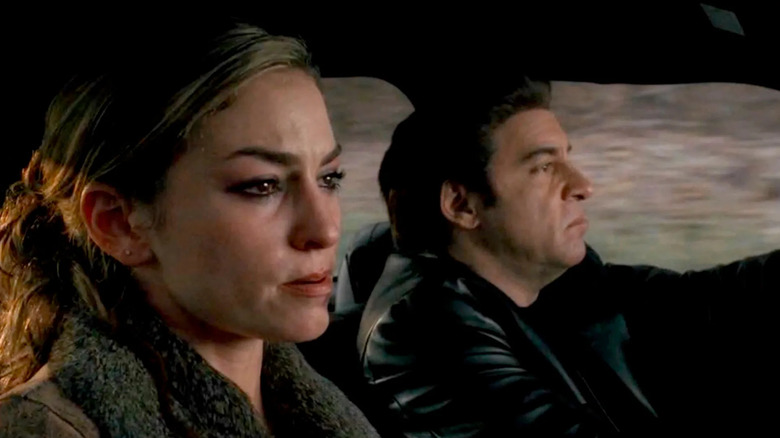 A teary-eyed Adriana La Cerva (Drea de Matteo) rides in a car driven by Silvio Dante (Steven Van Zandt) in The Sopranos