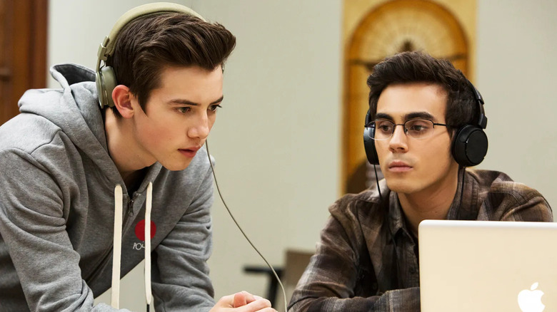 Griffin Gluck and Tyler Alvarez as Sam and Peter, listening to a clip on American Vandal