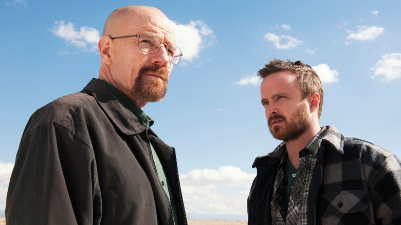 Bryan Cranston and Aaron Paul as Walter White and Jesse Pinkman, standing in the desert in Breaking Bad