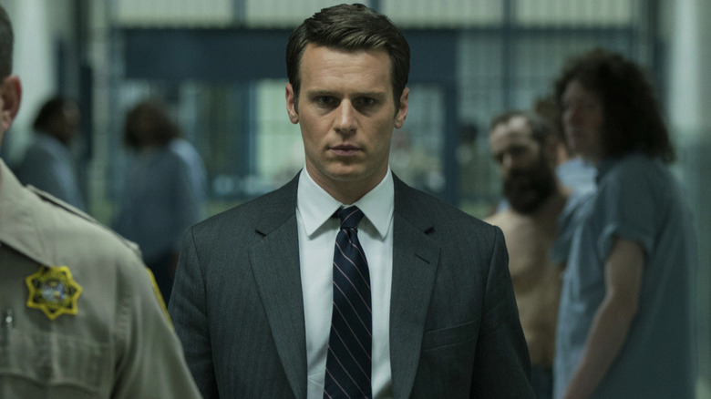 Jonathan Groff as Holden Ford, walking through a prison on Mindhunter