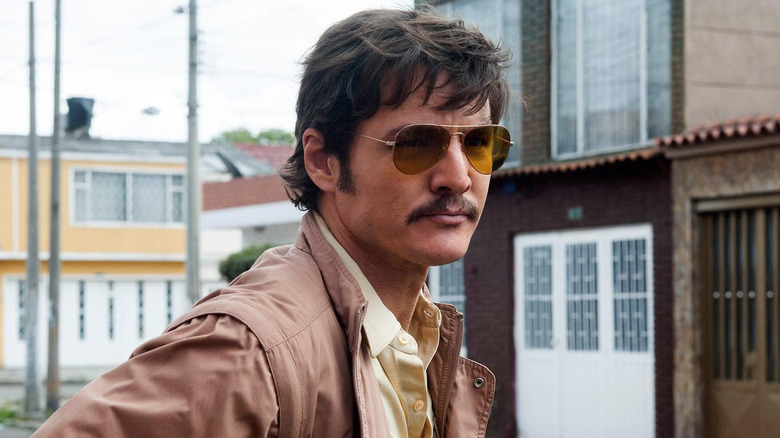 Pedro Pascal as Javier Peña, standing on the street in Narcos