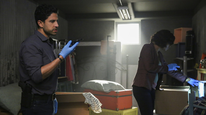 Adam Rodriguez as Luke Alvez, speaking into his phone while investigating a storage unit on Criminal Minds