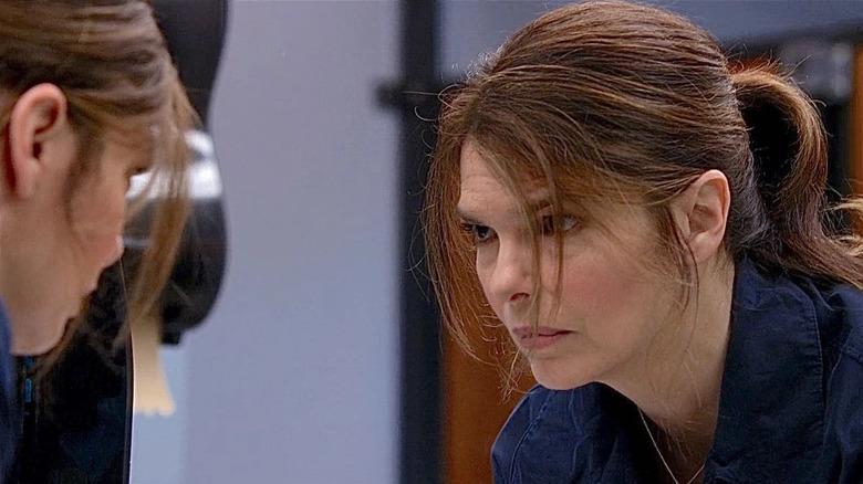 Jeanne Tripplehorn as Alex Blake, looking in the mirror on Criminal Minds