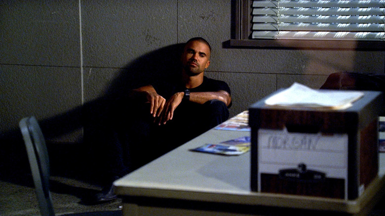 Shemar Moore as Derek Morgan, sitting on the floor of an interrogation room on Criminal Minds