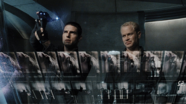John Anderton (Tom Cruise) looks for details on a transparent computer screen in Minority Report