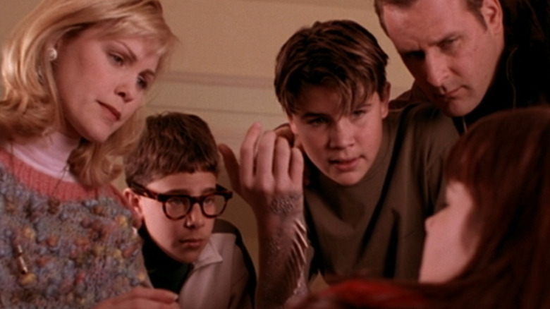 Cody (Chez Starbuck) showing Sam (Courtnee Draper) his mermaid arm in The Thirteenth Year