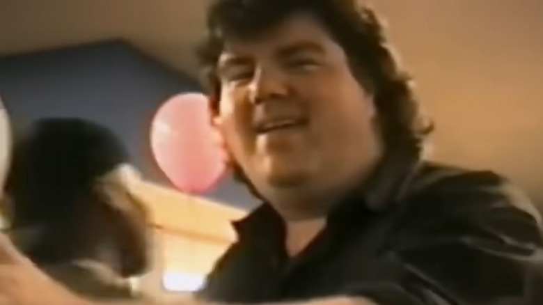 Archival footage of Dan Schneider smiling in Quiet on Set