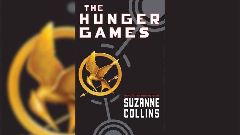 Mockingjay symbol on cover of The Hunger Games by Suzanne Collins