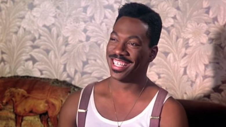 Eddie Murphy as Quick, celebrating a win in Harlem Nights