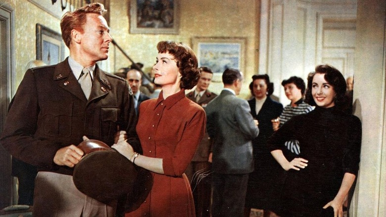 Elizabeth Taylor watches a nice couple