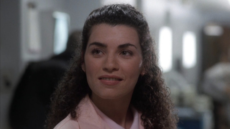 Close-up of Juliana Margulies in pink scrubs as Carol in ER